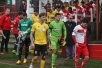 The teams enter the pitch